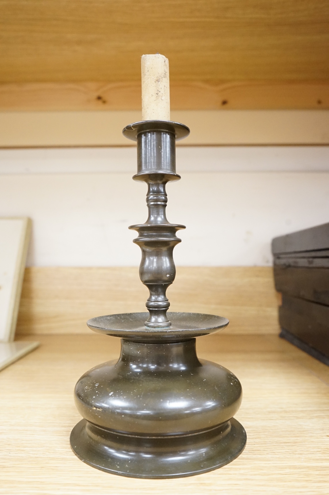 A Dutch bronze candlestick, 24cm high